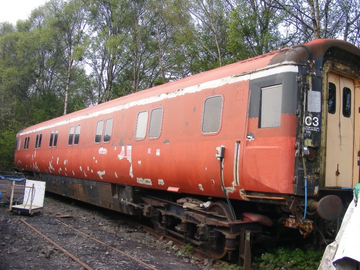 Now on temporary GSR bogies, the coach is on its specially-laid siding behind the shed, where it remained until 2014, 19th April August 2011. (C.Friel)
