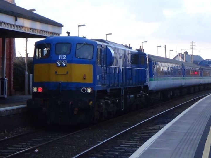 1/2/2015: GM 112 hauls the four coaches through Whitehead station and into the RPSI yard. (M.Wilson)