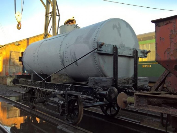 After some juggling, the tank settled down neatly. Here the wagon is departing the sheer legs for the carriage shed. (A.Davidson)
