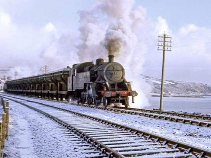 1968: No.4 on a winter's day leaving Whitehead with a loaded spoil train. (IRRS)