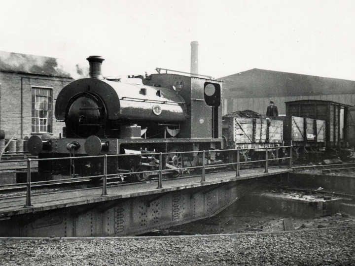 The locomotive doing some work for NIR back in 1968 - pictured shunting a wagon of ash from the turntable at York Road. Note the brackets in place to receive the 'Guinness' nameplate.
 (J.A.Cassells)