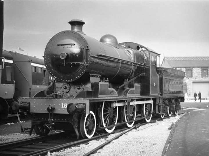 1968: No.461 at Inchicore open day. CIÉ staff have painted her up as DSER 15, in black with red lining. In DSER days she did not have the distinctive Inchicore style smokebox - and the white-wall tyres are a very un-Irish feature apparently added in a fit of creative passion. In the background is GNR(I) No.131. (C.P. Friel)