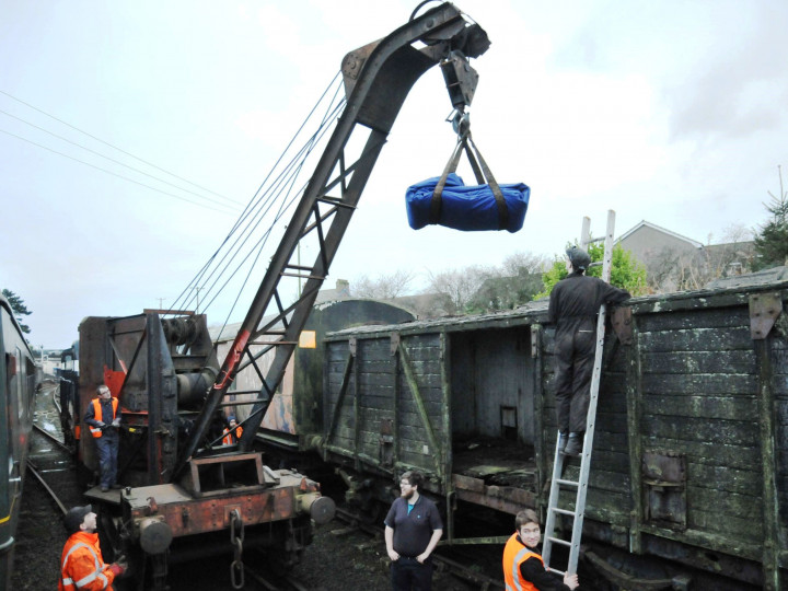 7/1/2017: Lifting a cover for (pre-restoration) Guinness Van 504. (C.P. Friel)