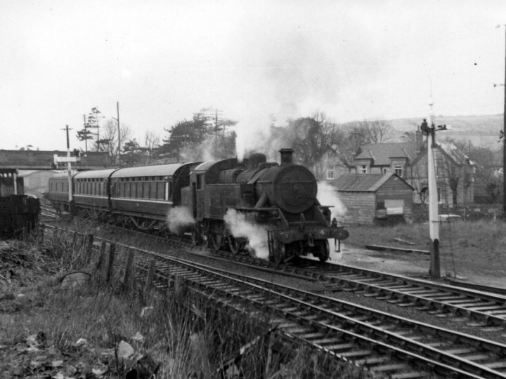 91 in the early NIR maroon livery and logo at Greenisland on Easter Monday 1970.
In the winter of 1969/70 NIR shopped the best of the remaining ex-NCC coaches, including 91, and turned them out in an all-over maroon livery with  broad light grey stripe. Used on diesel-hauled extra trains thereafter. (J.A. Cassells)